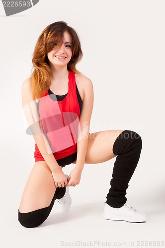 Image of young happy woman doing fitness exercise