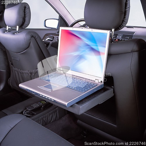 Image of car and laptop