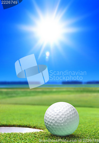 Image of golf ball on green course