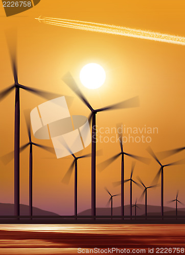 Image of silhouette of wind turbines