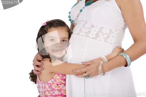 Image of Beautiful pregnant woman with her daughter. Isolated on white ba