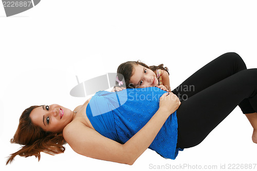 Image of Beautiful pregnant woman and her daughter