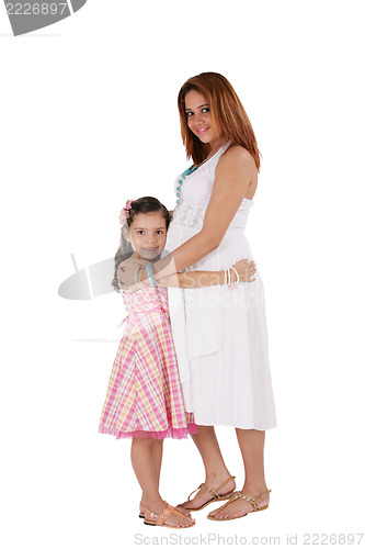 Image of Happy young pregnant woman with little daughter. Focus in the gi