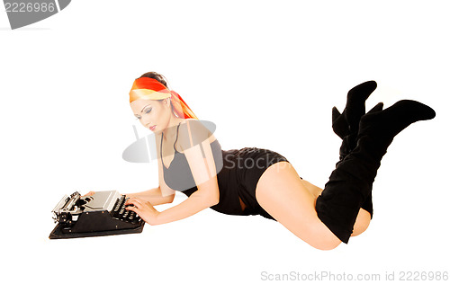 Image of Woman with typewriter.