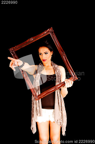 Image of Woman holding frame.