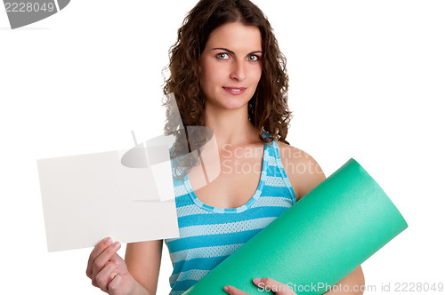 Image of Woman Holding a Mat and a White Empty Card