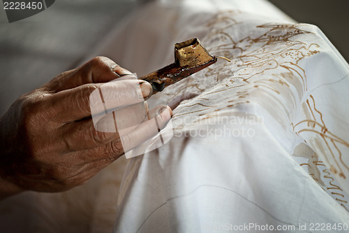 Image of Batik painting on a white cloth process