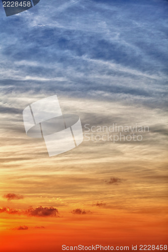 Image of Vertical sky background with gradient from blue to orange