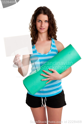Image of Woman Holding a Mat and a White Empty Card