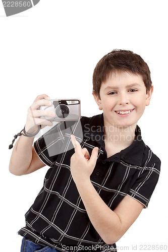 Image of small boy showing analog camera