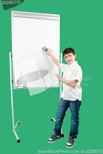 Image of Portrait of happy little boy showing white blank board