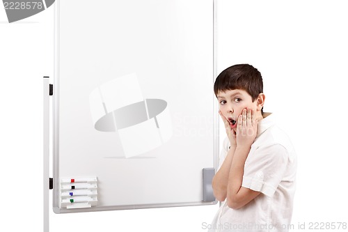 Image of wonder-struck little boy with white blank board