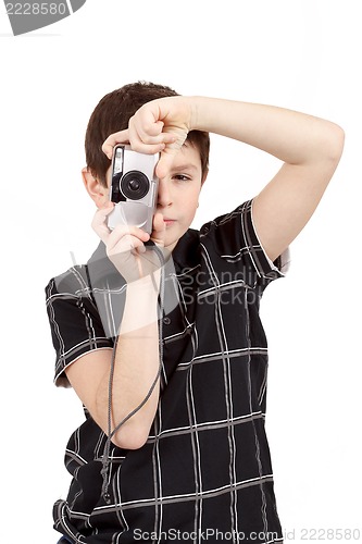 Image of small boy photographing vertical with digital camera