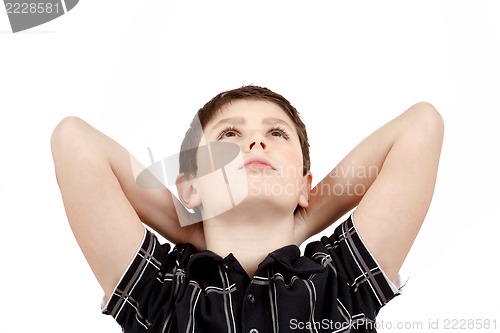 Image of Portrait of boy on white background, smiling, he looks up