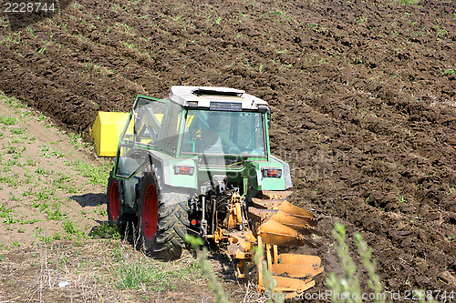 Image of tractor ploughing the land 