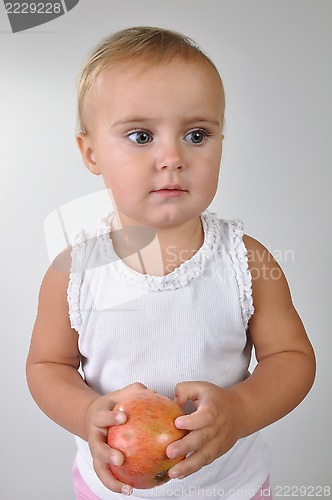 Image of toddler with an apple