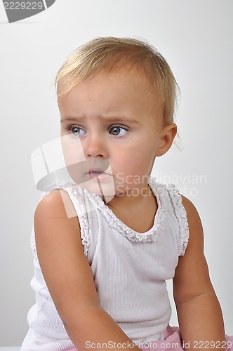 Image of pretty toddler girl looking aside