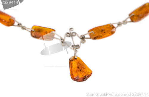 Image of amber stone blurred necklace isolated on white 