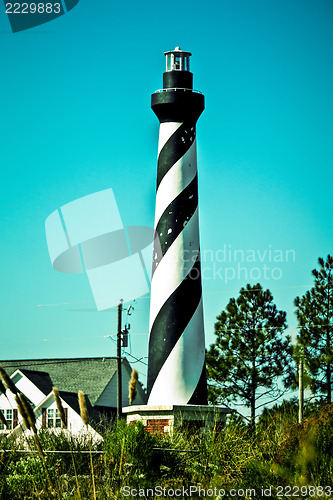 Image of an image of lighthouse in small town