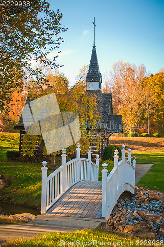 Image of small chapel across the bridge in fall