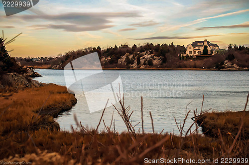 Image of House overlooking the ocean at sunset on the coastline along Rho