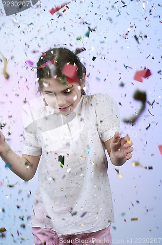 Image of child under the falling tinsel