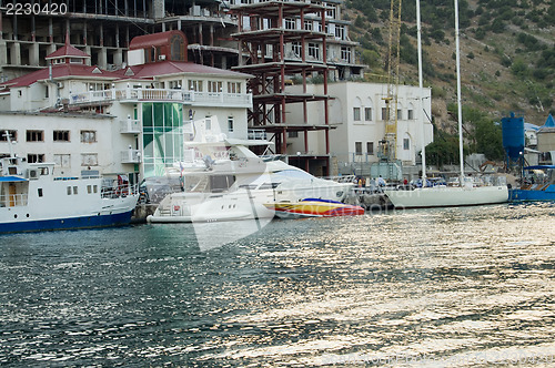 Image of yachts near a bank