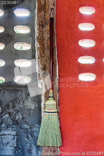 Image of Broom hanging on the wall ready for cleaning work 