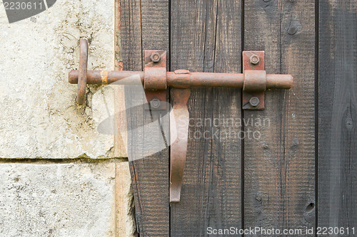 Image of Wrought iron lock old wooden door
