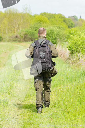 Image of Wildlife photographer with long telephoto