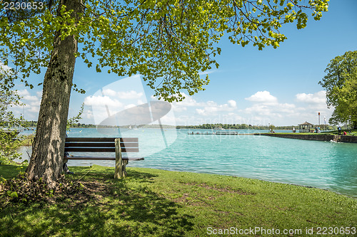 Image of Lake Chiemsee with tree and bench