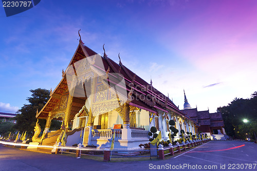 Image of Wat Phra Singh temple at sunset in Chiang Mai, Thailand.