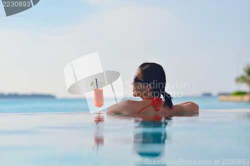 Image of beautiful gril on beach have fun