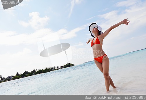 Image of beautiful gril on beach have fun