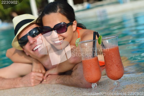 Image of happy young couple have fun on beach
