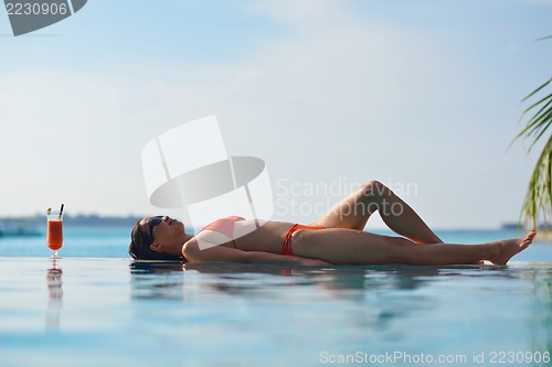 Image of beautiful gril on beach have fun