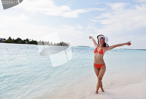 Image of beautiful gril on beach have fun