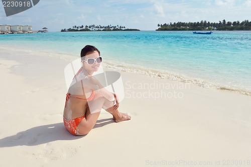 Image of beautiful gril on beach have fun