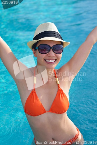 Image of beautiful gril on beach have fun