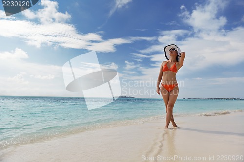 Image of beautiful gril on beach have fun