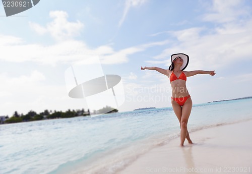 Image of beautiful gril on beach have fun