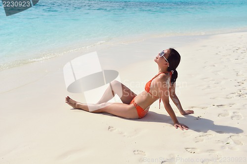 Image of beautiful gril on beach have fun