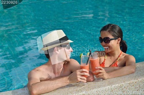 Image of happy young couple have fun on beach