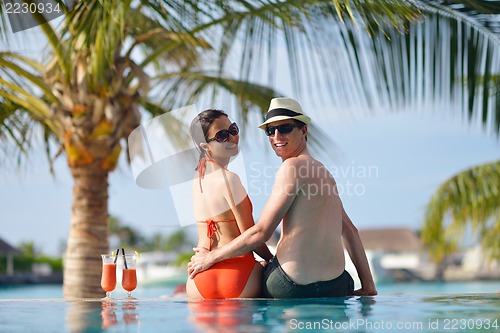 Image of happy young couple have fun on beach