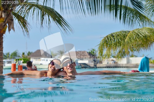 Image of happy young couple have fun on beach