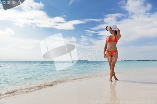Image of beautiful gril on beach have fun