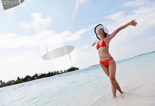 Image of beautiful gril on beach have fun