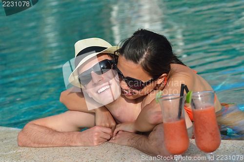 Image of happy young couple have fun on beach