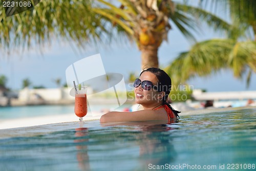 Image of beautiful gril on beach have fun