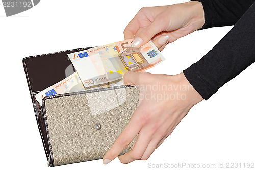 Image of Woman paying with euro from her purse